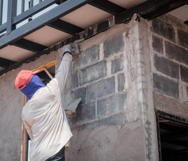 Man working on buildling Low angle